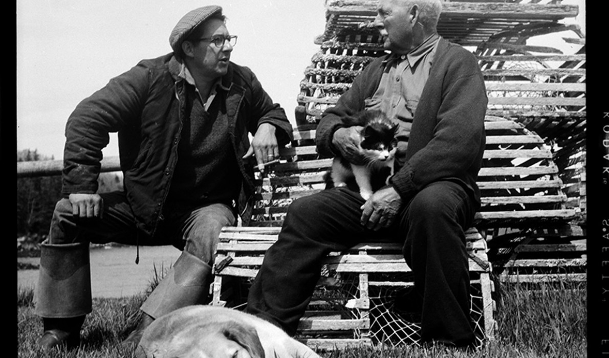 Fisherman George Curtis and retired fisherman William Leaman talk fishing (of course) outside of Leaman’s fish house in Owls Head in 1957. 