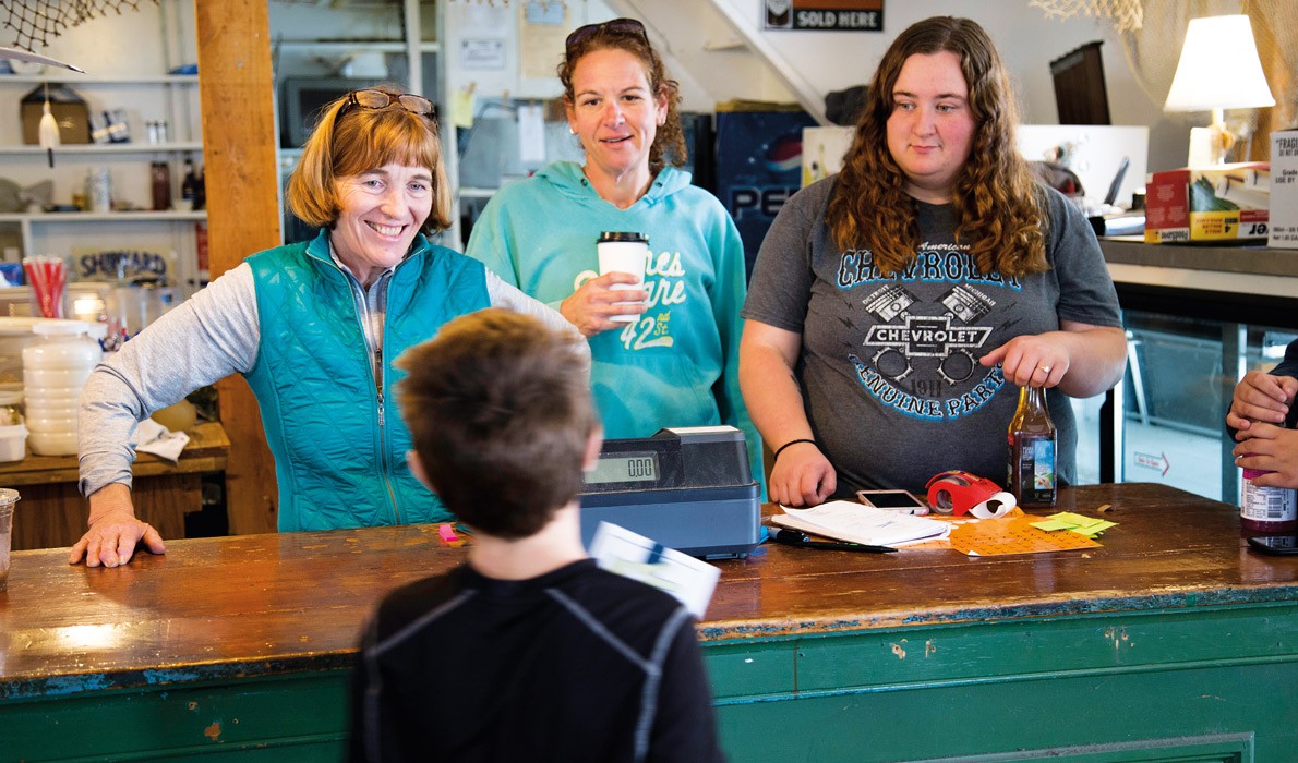 From left, Kathy Morton, one of the owners of the Harbor Gawker, along with her daughter, Amanda Roberts, and her granddaughter, Brianna Bartlett. The family talk with Cody Roberts, Morton's grandson.