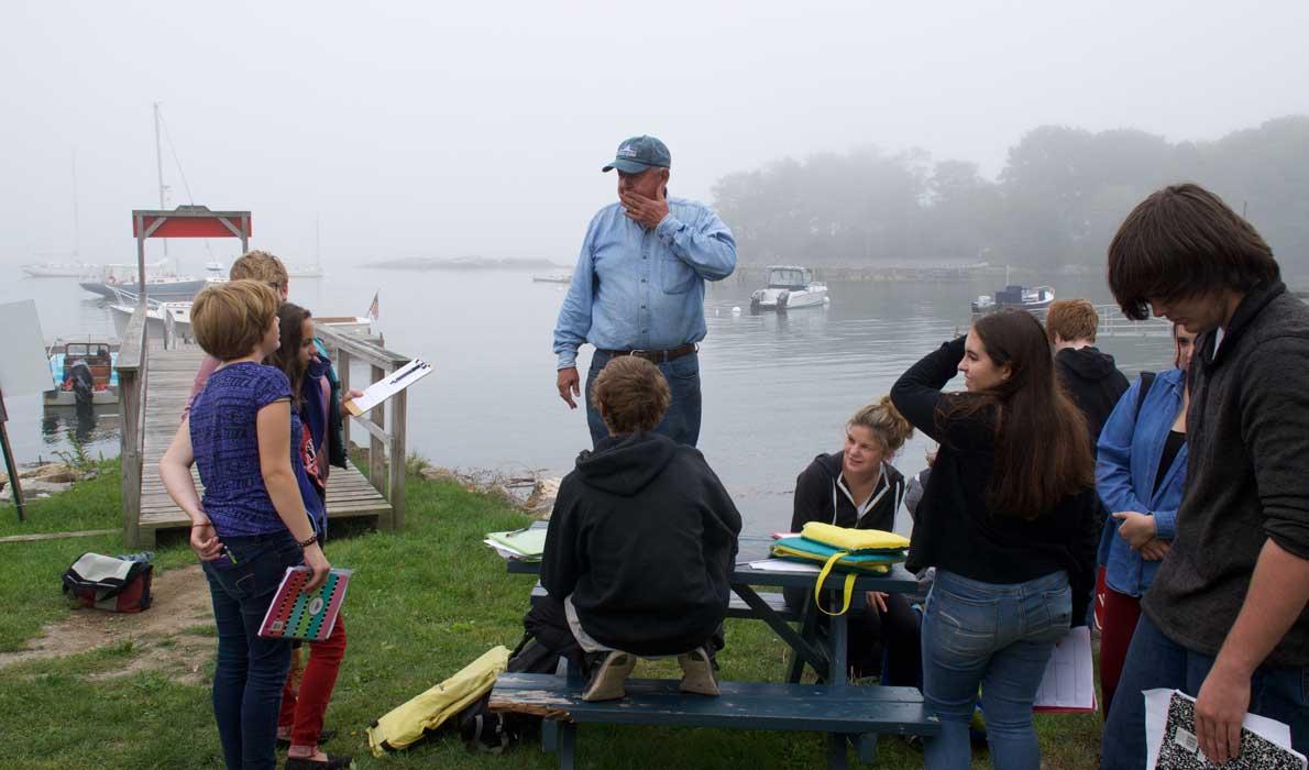 Students from Harpswell Coastal Academy work in the field.