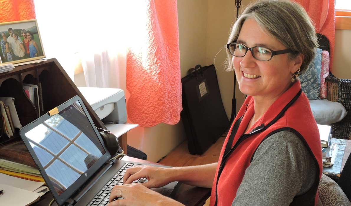 Lora Whelan, working at home in Eastport.