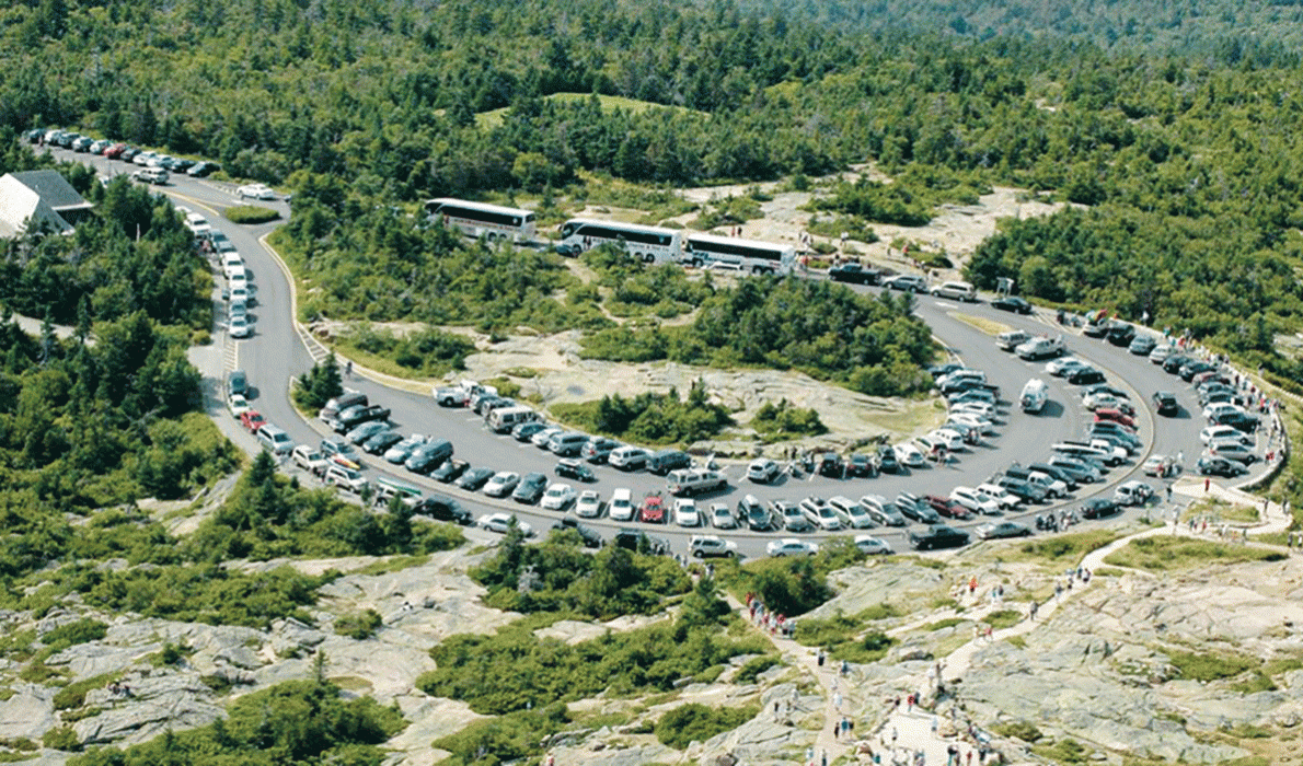 Top of Cadillac crowded with cars