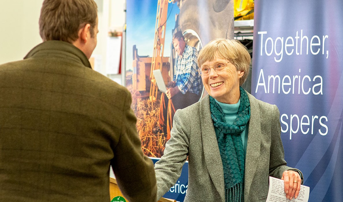 Arrowsic's Sukey Heard greets the Island Institute's Nick Battista.