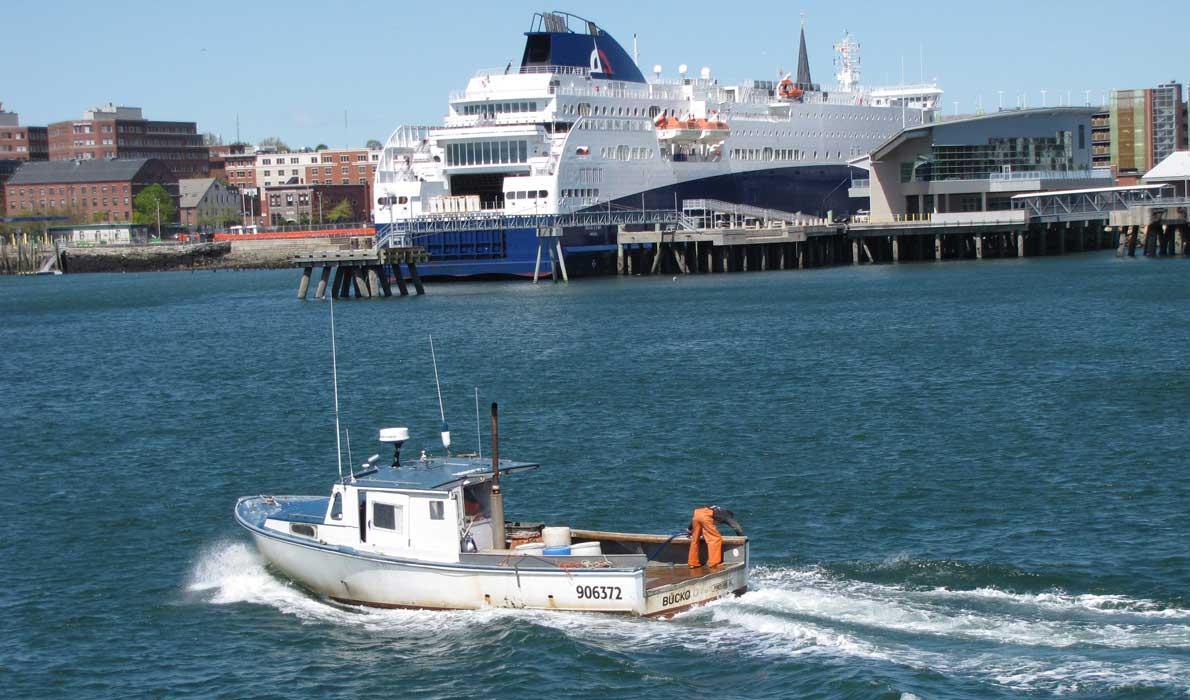 Lobster boat crosses behind Nova Star