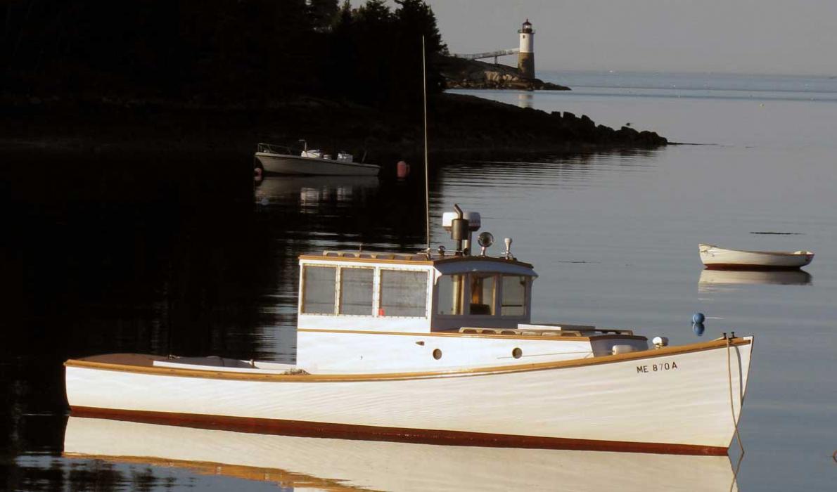 Lobster boat and lighthouse