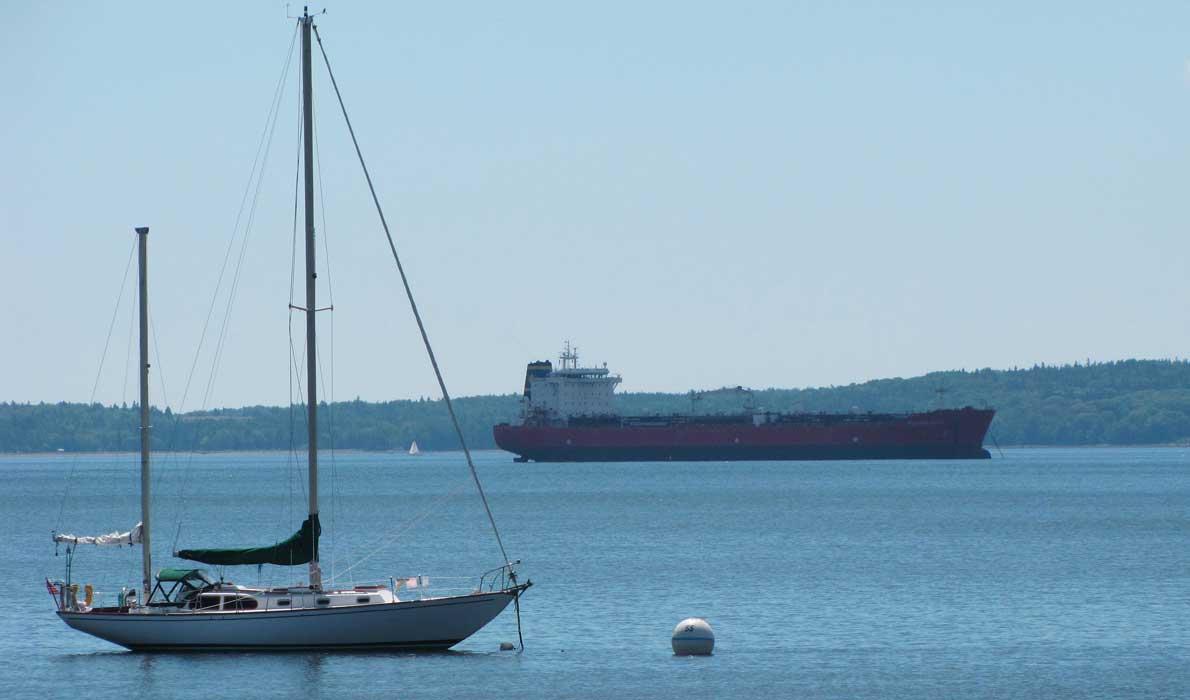 Sailboat, cargo ship off Searsport