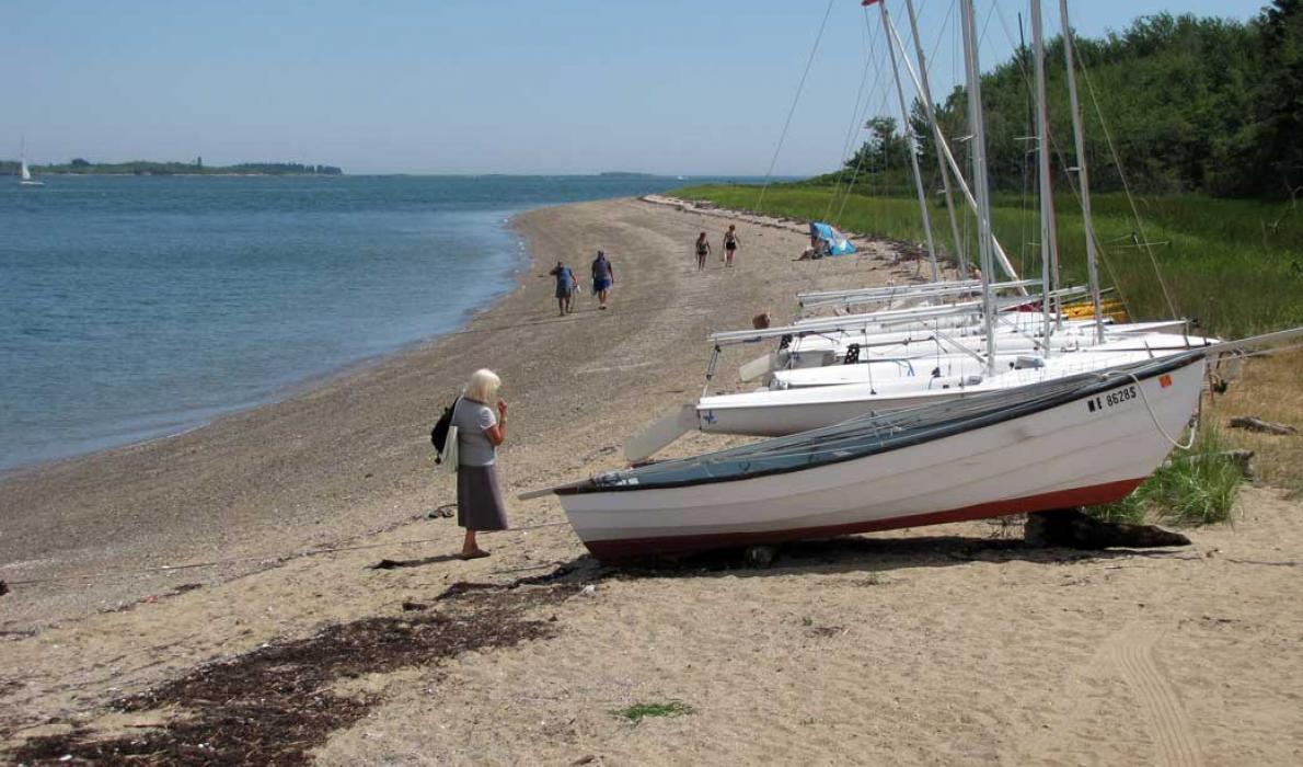 Sailboats and people on Chebeague Island shore