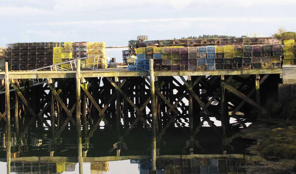 Lobster traps piled on a dock in Corea.